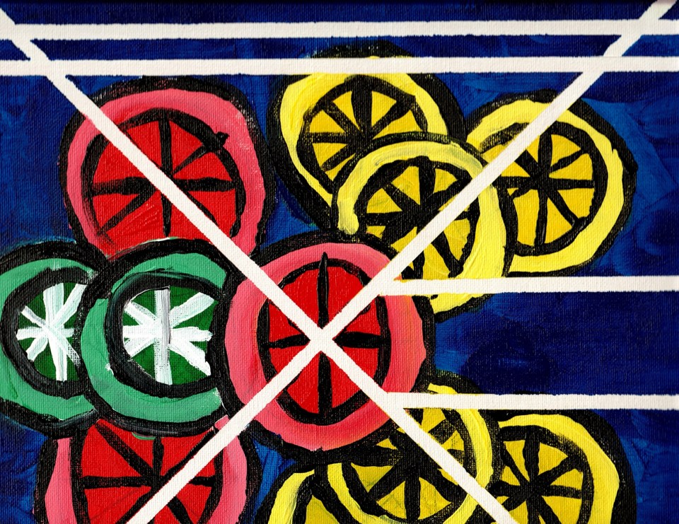 Slices of citrus fruit on blue background