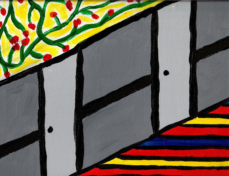 A hallway with gray walls and doors, flowered wallpaper, and brightly colored carpet