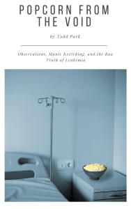 Empty hospital bed with bowl of popcorn on the stand